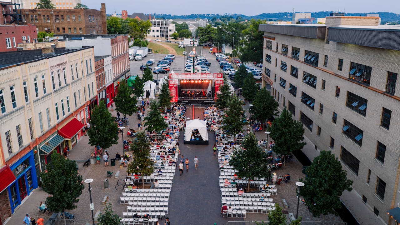 who-we-are Aerial view of an outdoor concert in Chattanooga, capturing vibrant city vibes and a lively gathering.