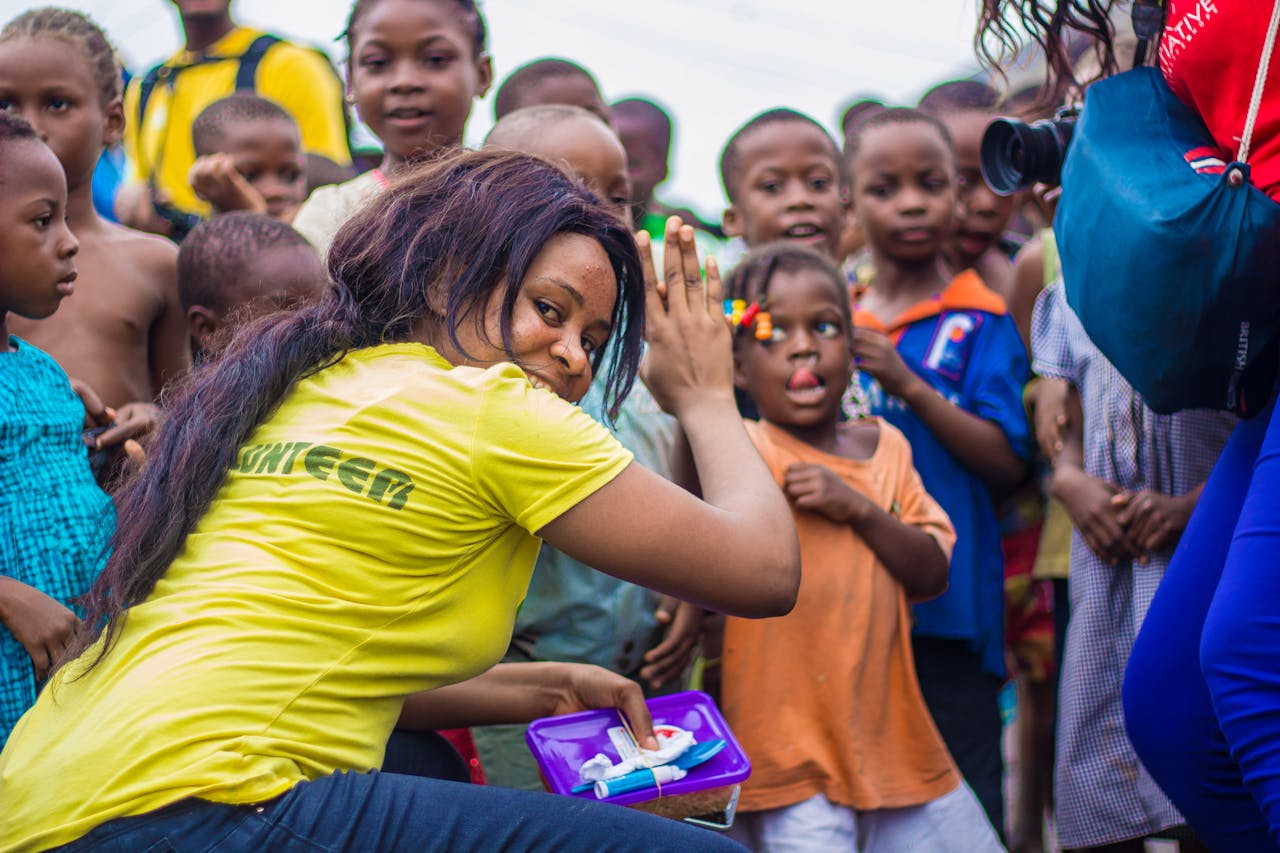 Mastering the First Impression: Your intriguing post title goes here A vibrant scene of children and volunteers participating in an outdoor community outreach activity.